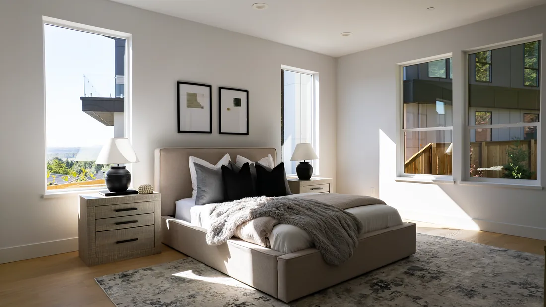 Bright bedroom with new white windows installed by Gorilla Works